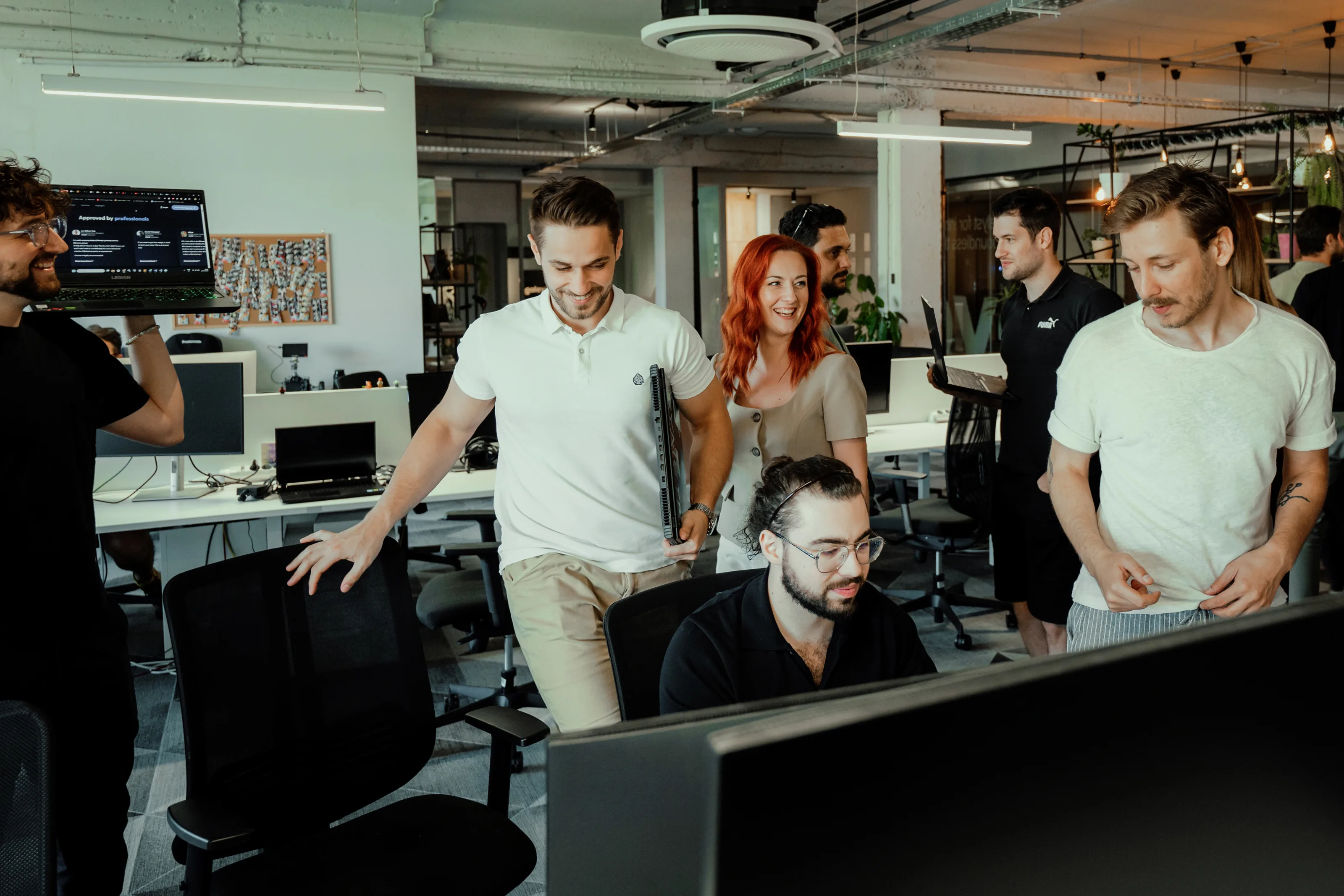 Galeyo team collaborating in open office during planning session